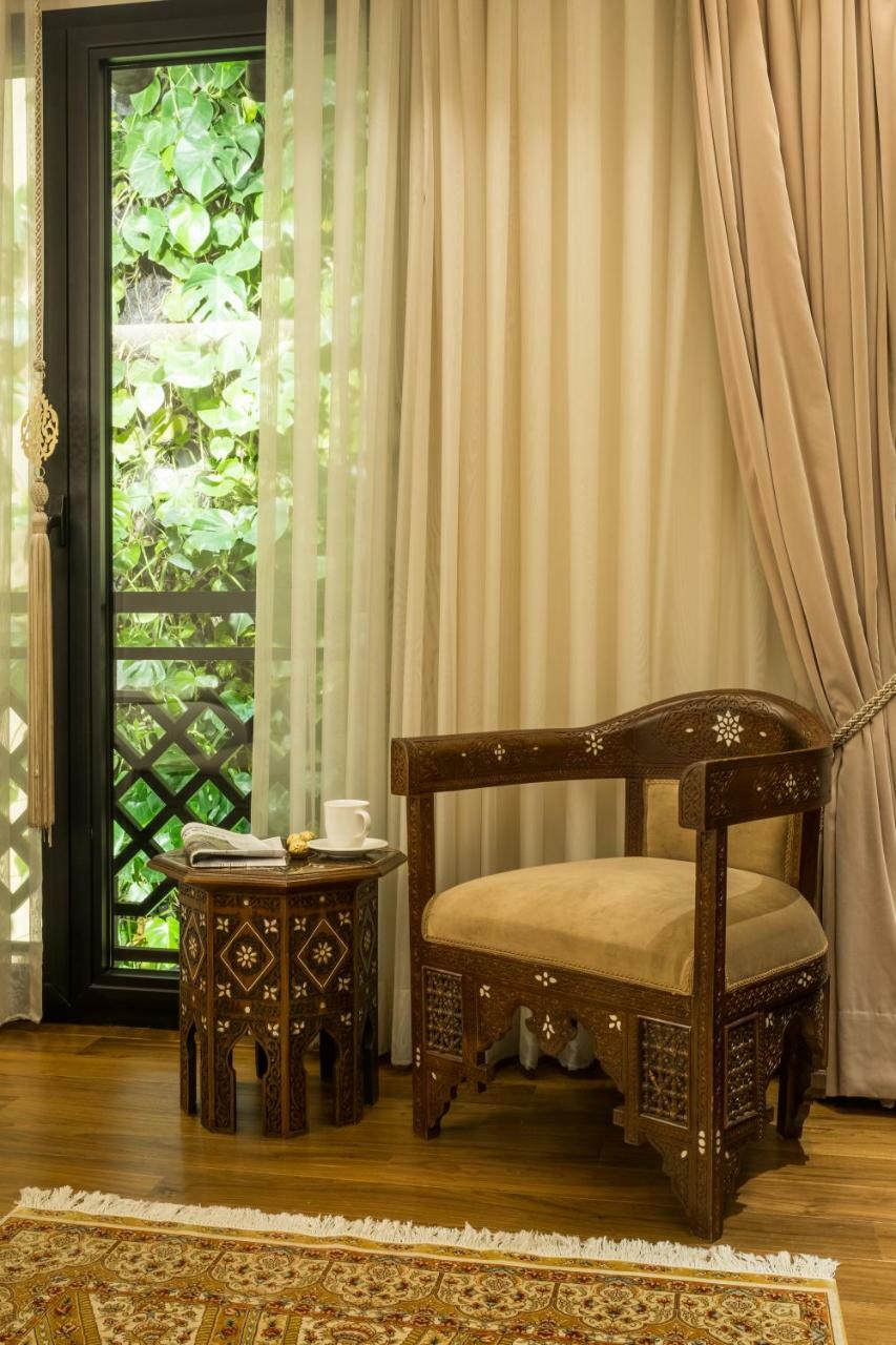 Quarto Deluxe com 2 Camas de Solteiro e Vista Vertical da Área Verde
